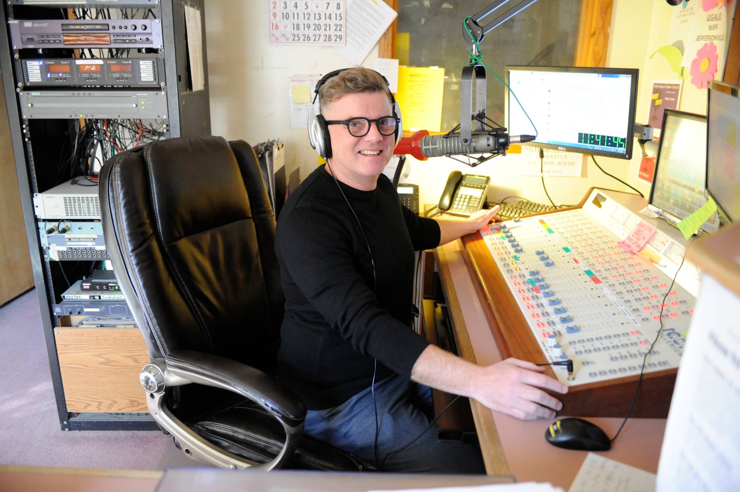 Switching from analog to digital, and no more mice. WJFF’s general manager Tin Bruno takes a turn on the board in the station’s outdated broadcast studio, a place where mice once chewed through some wiring.